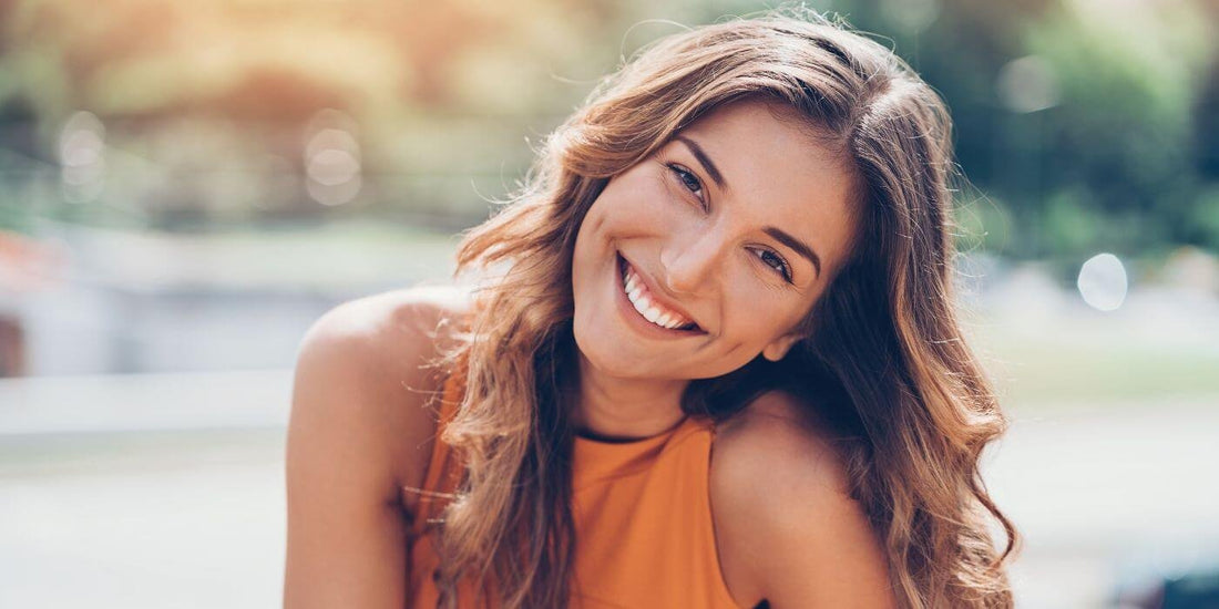 A photo of a woman smiling.