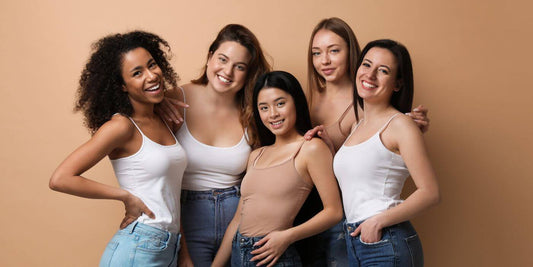 A photo of a group of smiling women.